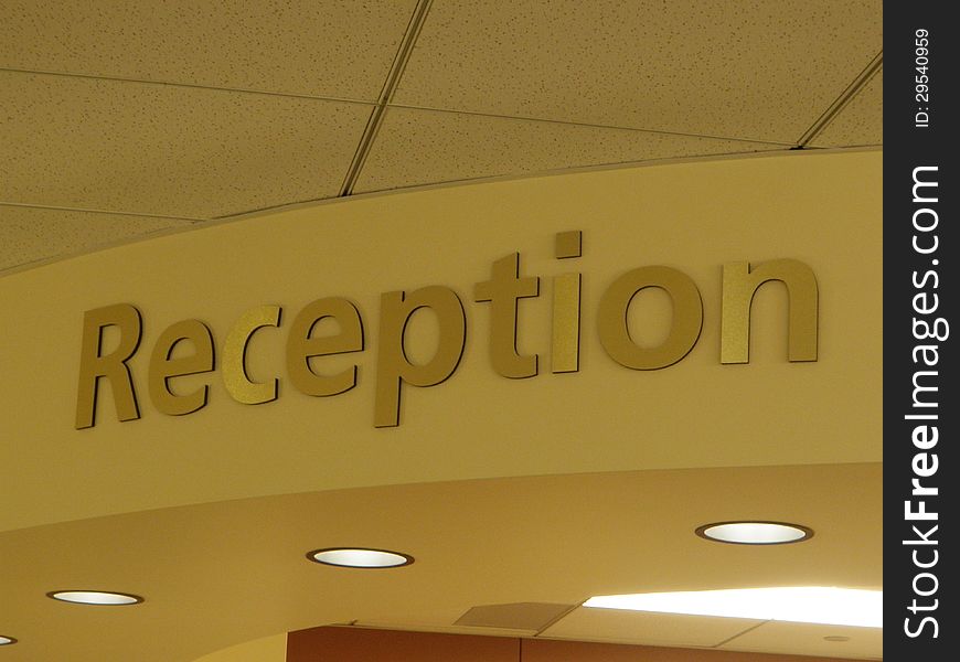 Brass colored sign in reception area of a doctor's office. Brass colored sign in reception area of a doctor's office.