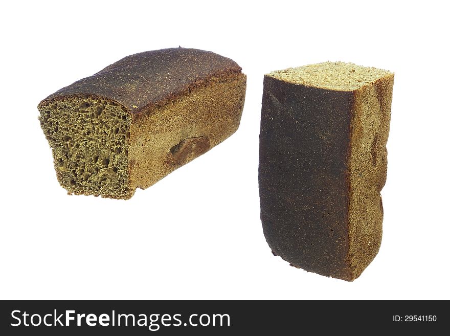 Loaf of rye bread, cut into two parts, isolated on white
