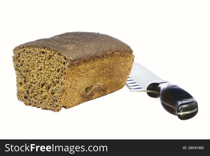 Half loaf of rye bread and knife isolated on white background. Half loaf of rye bread and knife isolated on white background