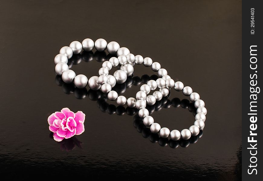 Pearl bracelets on a black background