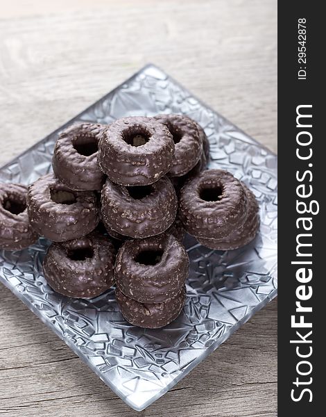 Chocolate tea biscuits on wooden table