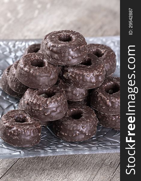 Chocolate tea biscuits on wooden table