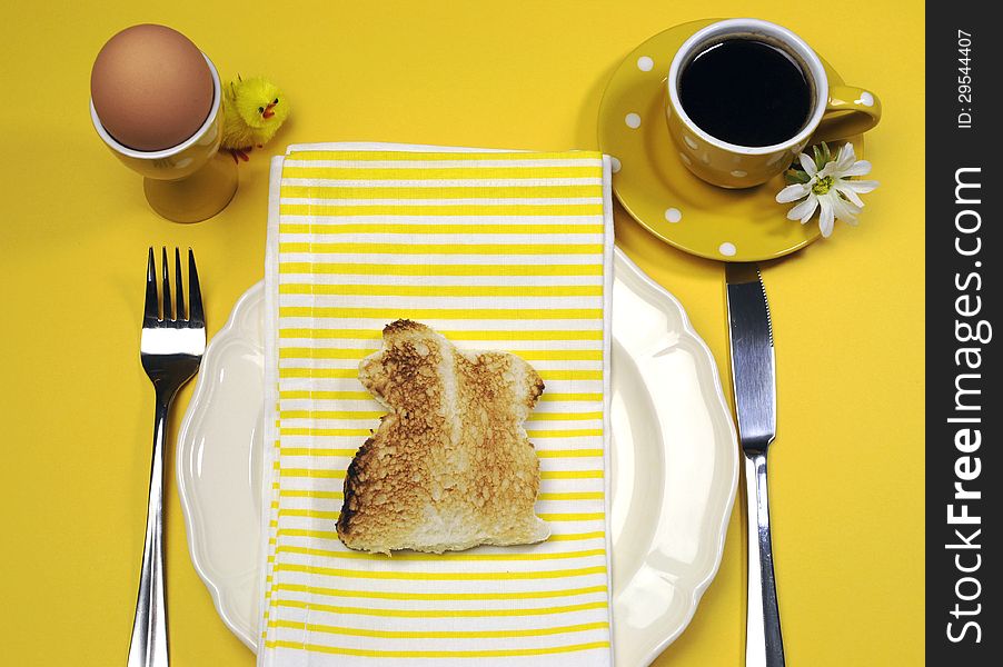 Yellow theme Happy Easter breakfast table with bunny rabbit toast