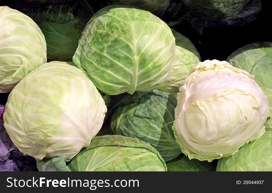 Cabbage on display in a market.