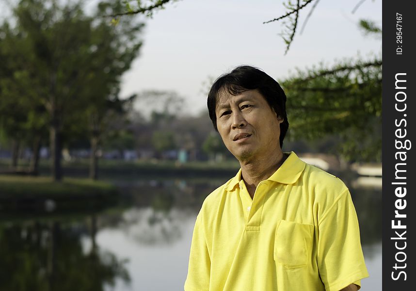Portrait of a happy asian man thailand park