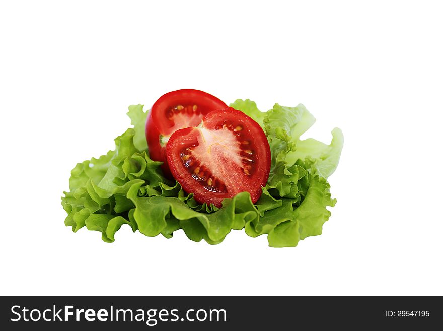 Halves of tomatoes in the salad on a white background