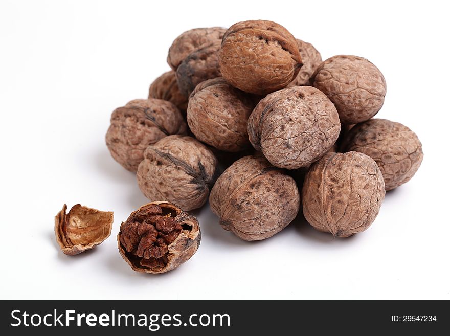 Uglans is a plant genus of the family Juglandaceae, the seeds of which are known as walnuts. They are deciduous trees, 10â€“40 meters tall (about 30â€“130 ft), with pinnate leaves 200â€“900 millimetres long (7â€“35 in), with 5â€“25 leaflets; the shoots have chambered pith, a character shared with the wingnuts (Pterocarya), but not the hickories (Carya) in the same family.