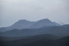 Landscape Of The Trans-Ili Alatau Mountains On An Early Cloudy Morning In Thick Morning Fog, Haze Stock Photography