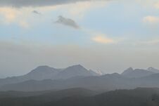 Mountains Of Trans-Ili Alatau On An Early Cloudy Morning In The Morning Fog During Sunrise Stock Image