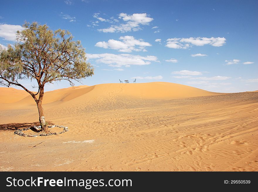 Wrought iron table and chairs on the top of sand dune