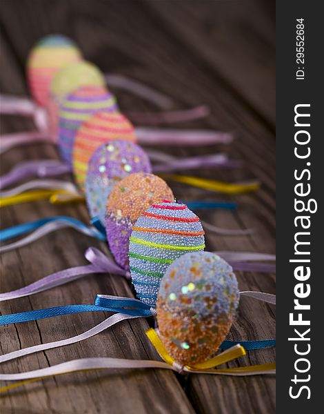 Decorative Easter eggs on a wooden table.