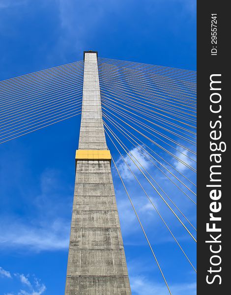 The pole of the cable bridge with blue sky and cloudy. The pole of the cable bridge with blue sky and cloudy