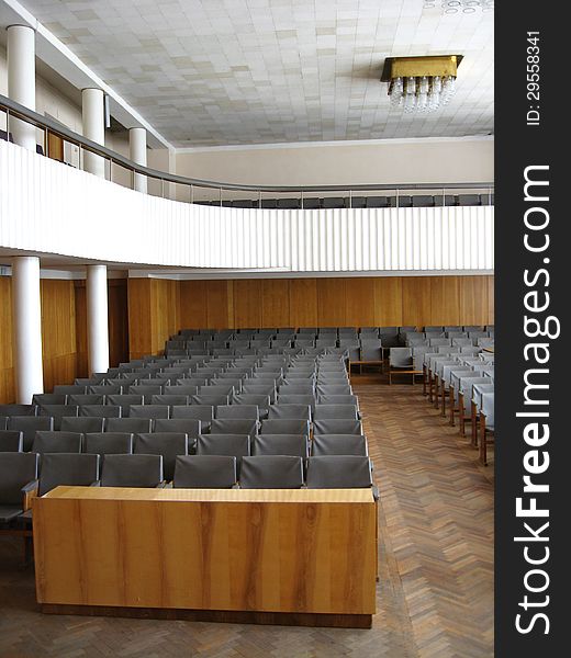 The image of conference room with dark chairs