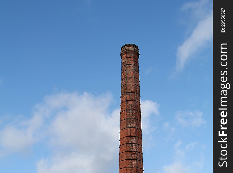 A Traditional Brick Built Tall Industrial Chimney.