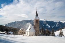A Wintertime View Of A Small Church With A Tall Steeple Stock Image