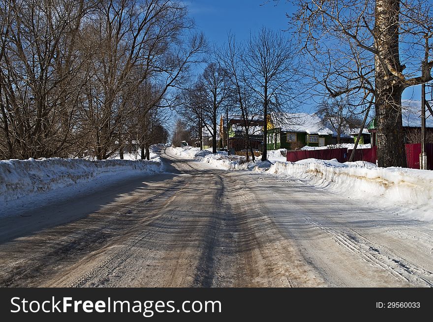 Snowy Road In A Village