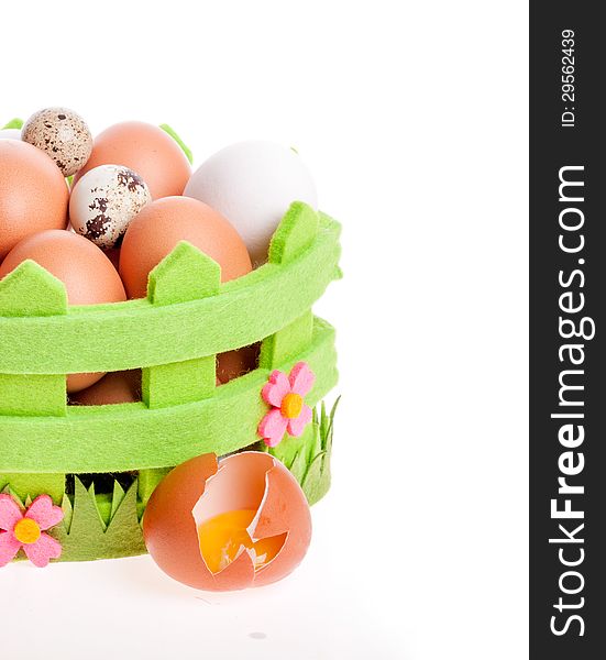 Broken Chicken Egg Lies Near A Decorative Basket Of Eggs