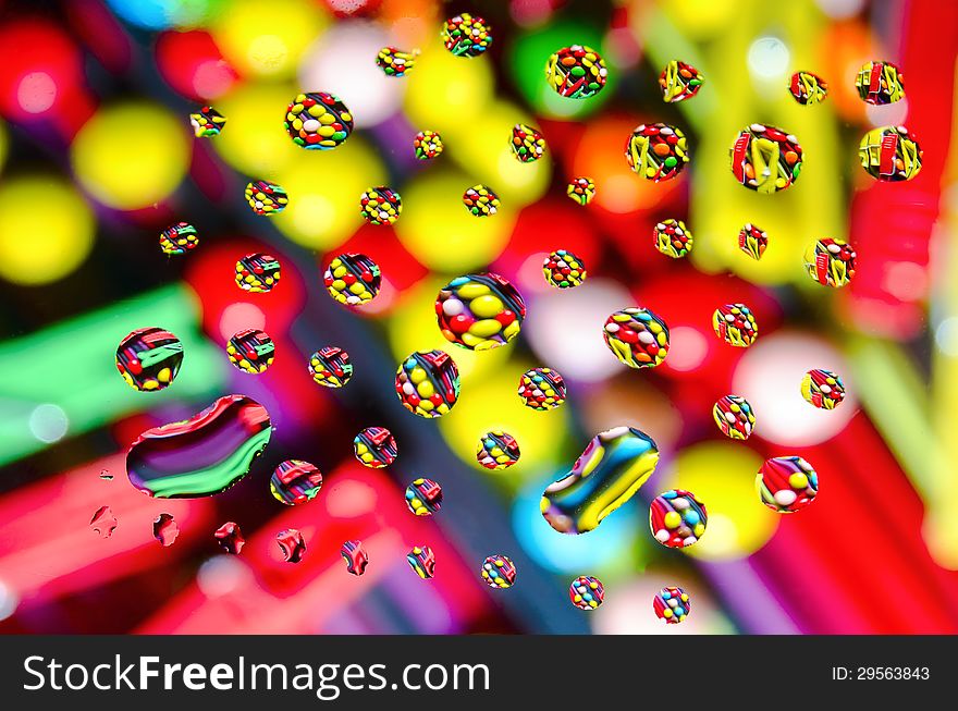 Abstract background of colored drops on the glass. Abstract background of colored drops on the glass