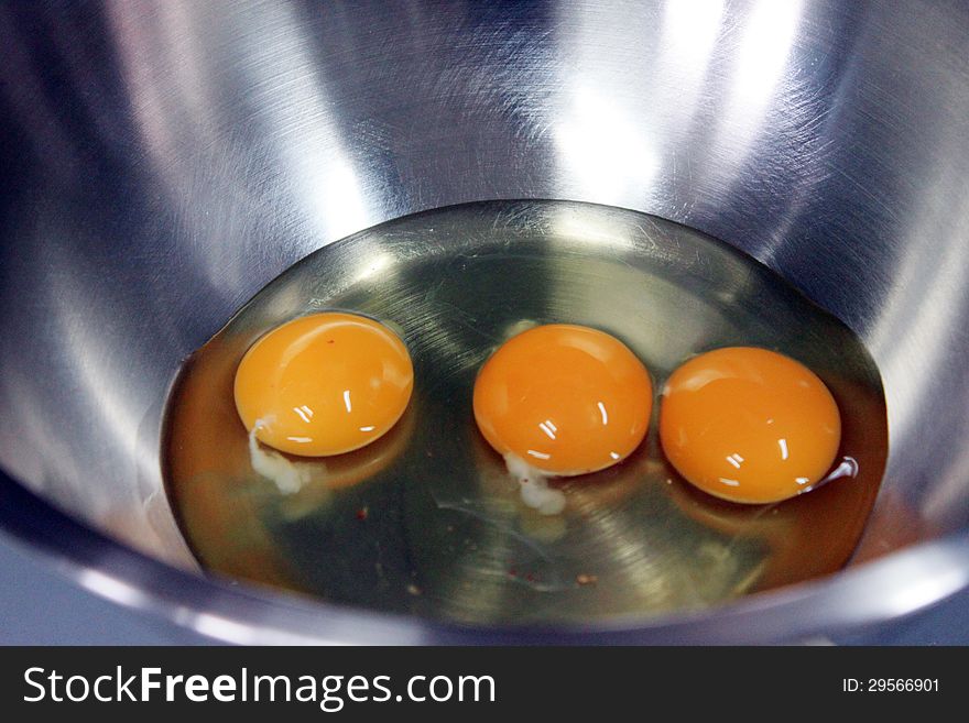 Three Egg Yolk in stainless Container.