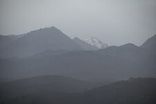 Landscape Of The Trans-Ili Alatau Mountains On An Early Cloudy Morning In Thick Morning Fog, Haze Stock Photos