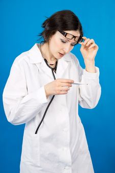 Woman Doctor With A Thermometer Stock Photo Woman Doctor With A Thermometer Stock Photo