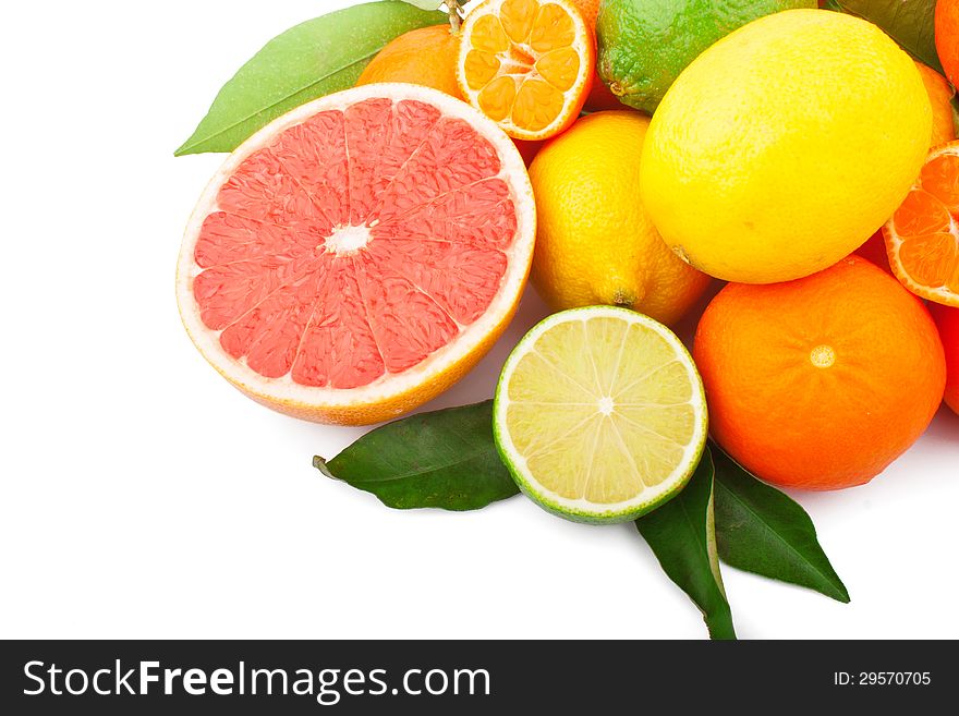 Fresh citrus fruits whole and half with green leaves, food ingredient photo