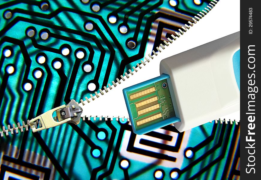 Photo showing a pcb board being unzipped to reveal a digital memory stick for computing purposes. Photo showing a pcb board being unzipped to reveal a digital memory stick for computing purposes.