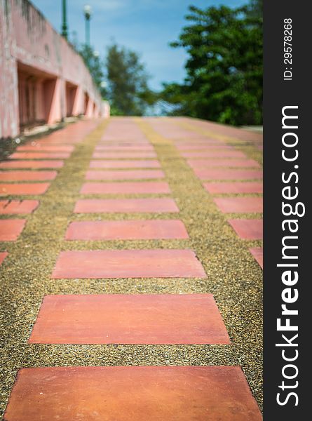 Empty sidewalk on a bridge with blue sky