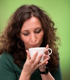 Curly Woman With A Cup Of Tea Or Coffee Stock Photography Curly Woman With A Cup Of Tea Or Coffee Stock Photography