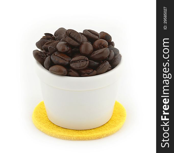 Cup of Coffee beans on white background