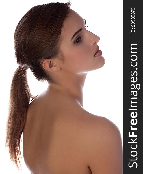 A portrait of a pretty teen with a bare back. A portrait of a pretty teen with a bare back