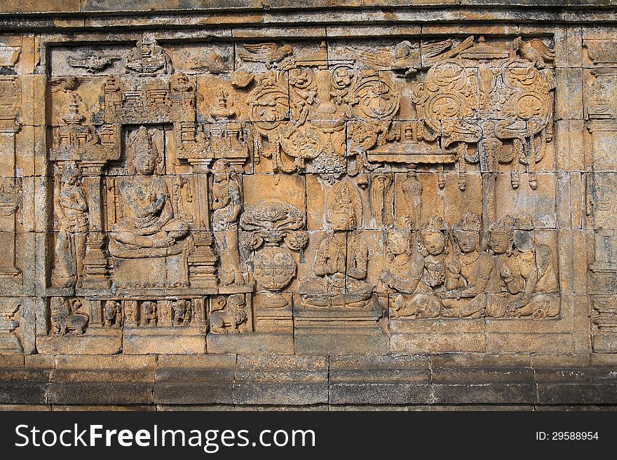 Bass-relief on the wall in Borobudur Buddhist temple, Indonesia, Java. Bass-relief on the wall in Borobudur Buddhist temple, Indonesia, Java
