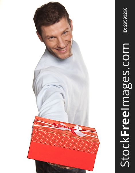 Handsome Man Offering A Present On White Background. Handsome Man Offering A Present On White Background