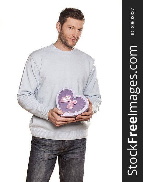 Handsome Man Offering A Present On White Background. Handsome Man Offering A Present On White Background