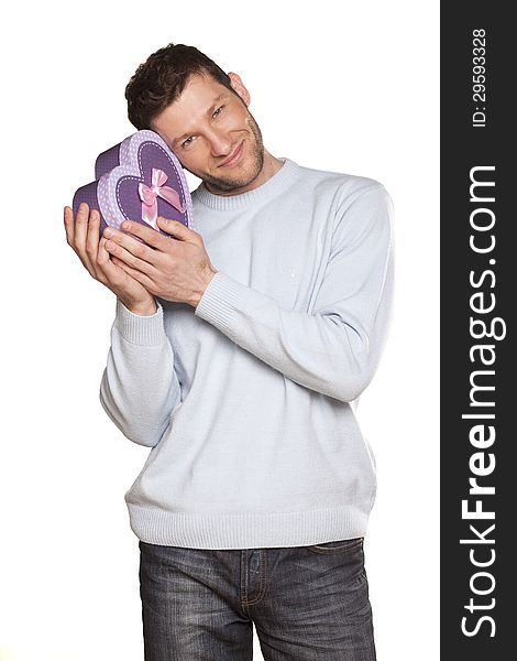 Handsome Man Offering A Present On White Background. Handsome Man Offering A Present On White Background