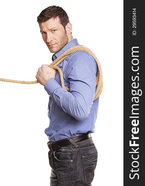 Young man holding rope on white background