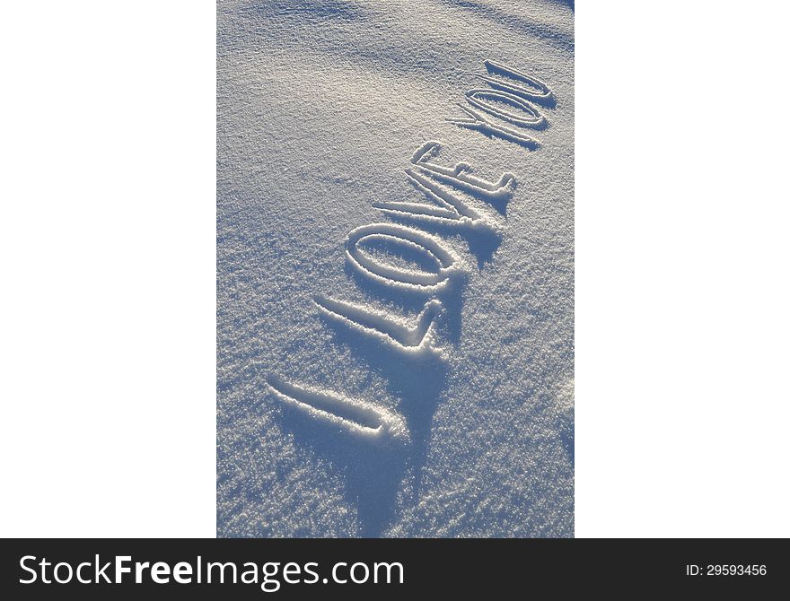 Writing text I LOVE YOU on the white snow surface. Writing text I LOVE YOU on the white snow surface