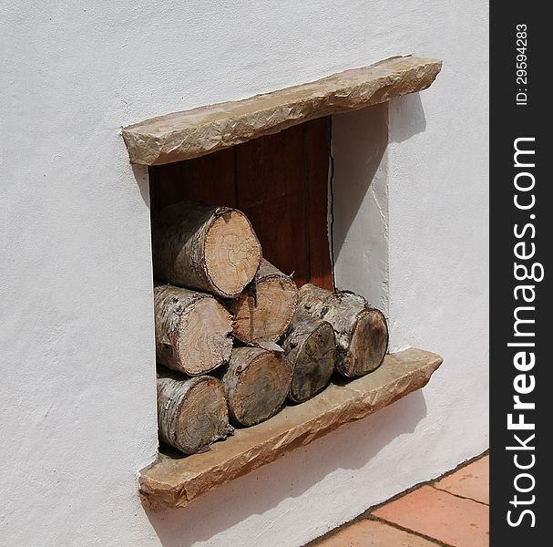 A Firewood Log Store Recessed into a Wall. A Firewood Log Store Recessed into a Wall.