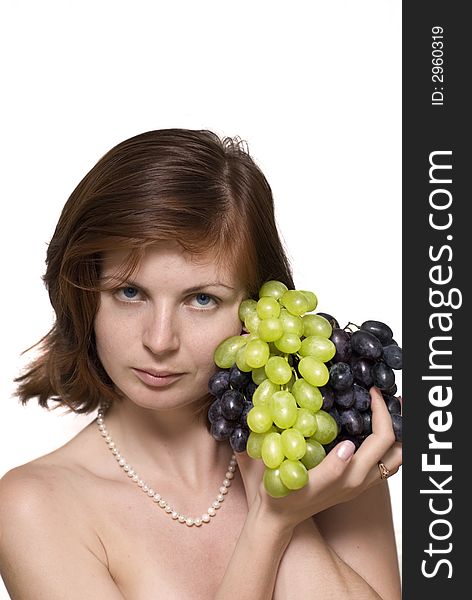 Pretty girl with green and black grape on white background. Pretty girl with green and black grape on white background