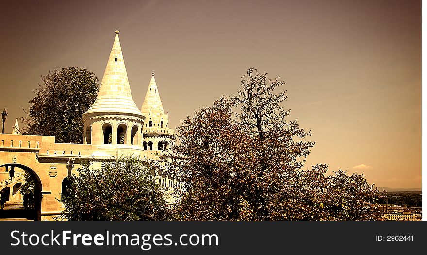 The great tower of Fishermen's Bastion on the castle hill of Budapest in sepia