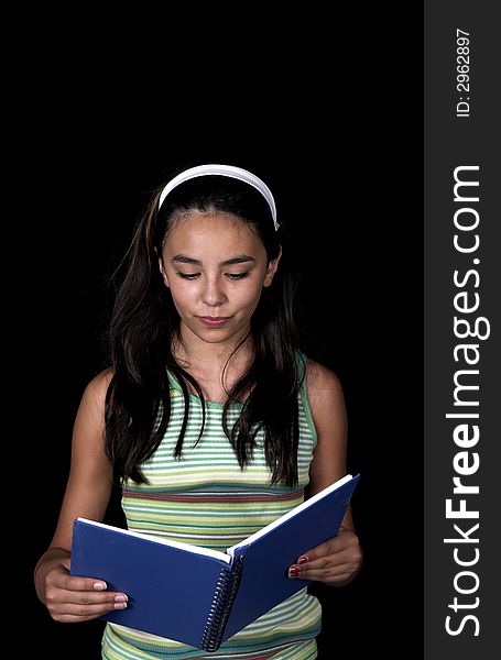 Girl posing for back to school theme over black background