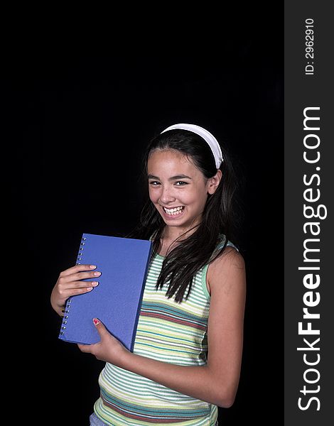 Girl posing for back to school theme over black background