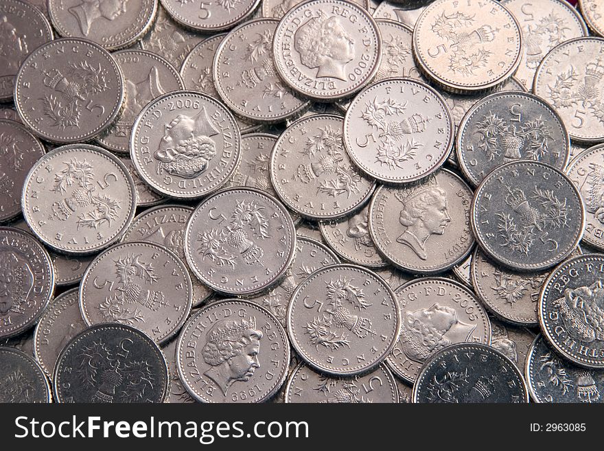 Lots of British five pence coins