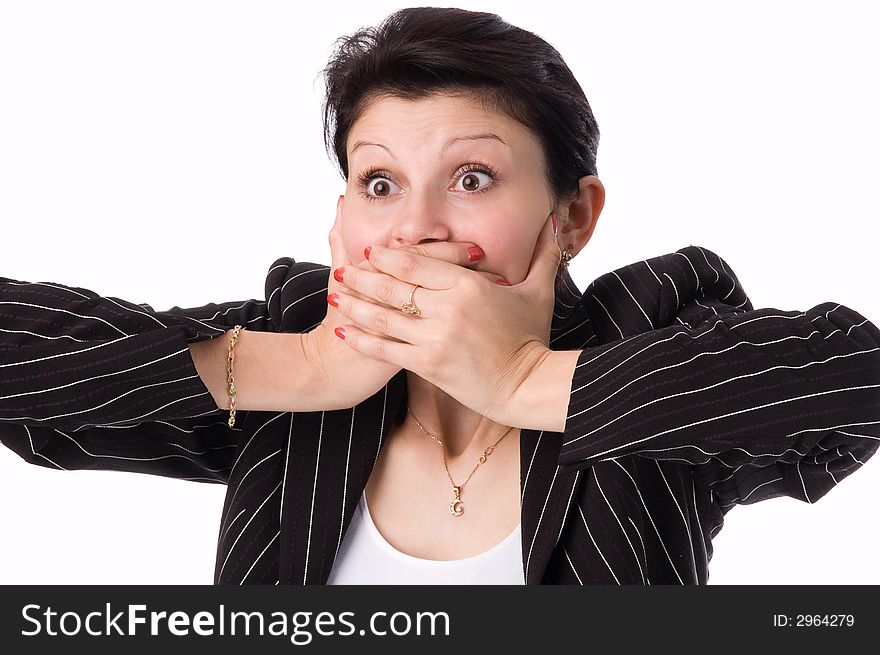 The woman in a business suit clamps hands a mouth. The woman in a business suit clamps hands a mouth