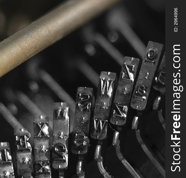 Closeup of typebars on a vintage typewriter