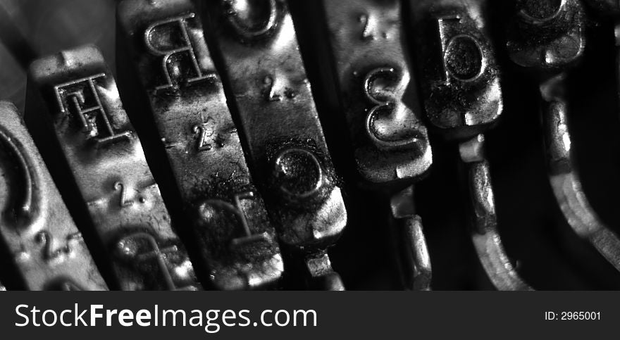 Closeup of typebars on a vintage typewriter