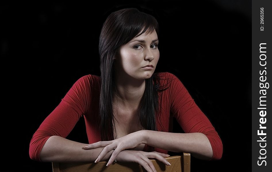 Pretty girl in red top, black background