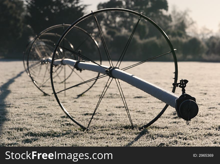 Irrigation system with a coating of frost in later winter in Canterbury, New Zealand. focus on sprinkler head, shallow DOF. Irrigation system with a coating of frost in later winter in Canterbury, New Zealand. focus on sprinkler head, shallow DOF.