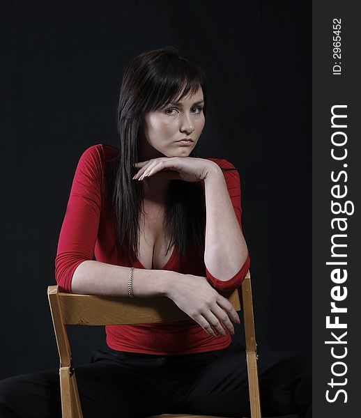 Pretty girl in red top, black background