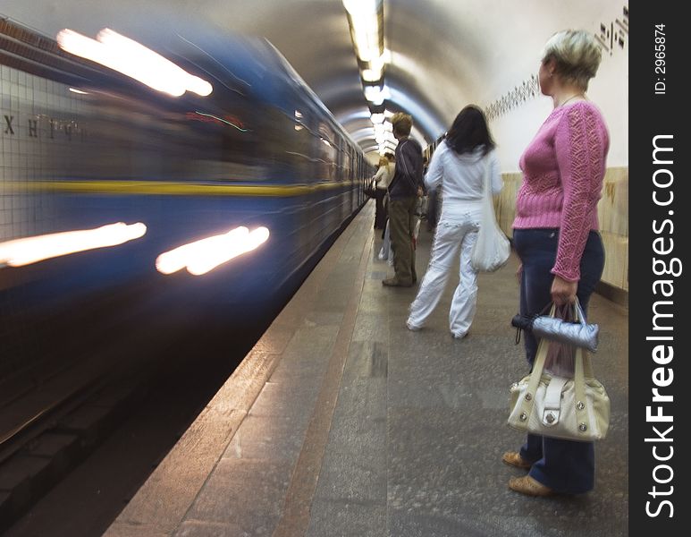 People waiting for the next train. Motion blurred. People waiting for the next train. Motion blurred.